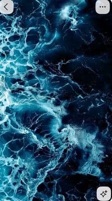 a cell phone with a picture of a blue ocean