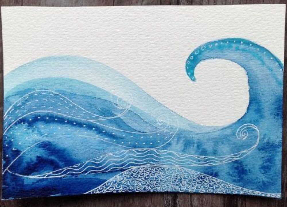 a painting of an ocean wave on a piece of paper