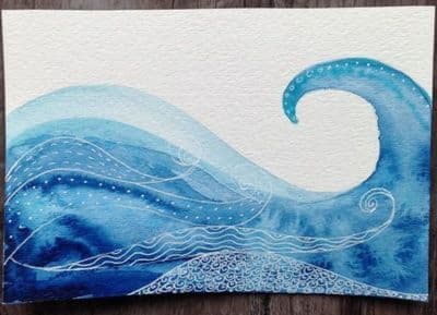 a painting of an ocean wave on a piece of paper