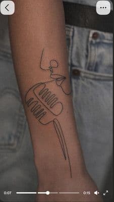 a person with a tattoo on their arm
