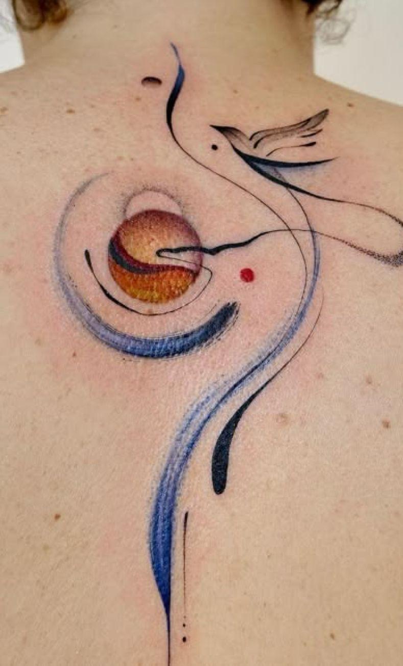 a woman with a tattoo on her back