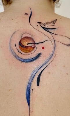 a woman with a tattoo on her back