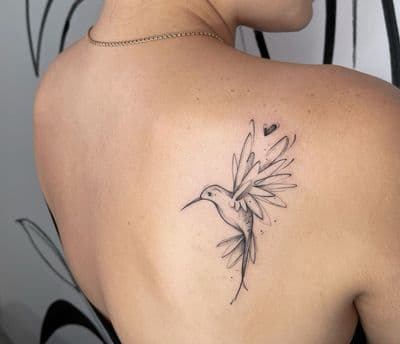 a woman with a tattoo on her back