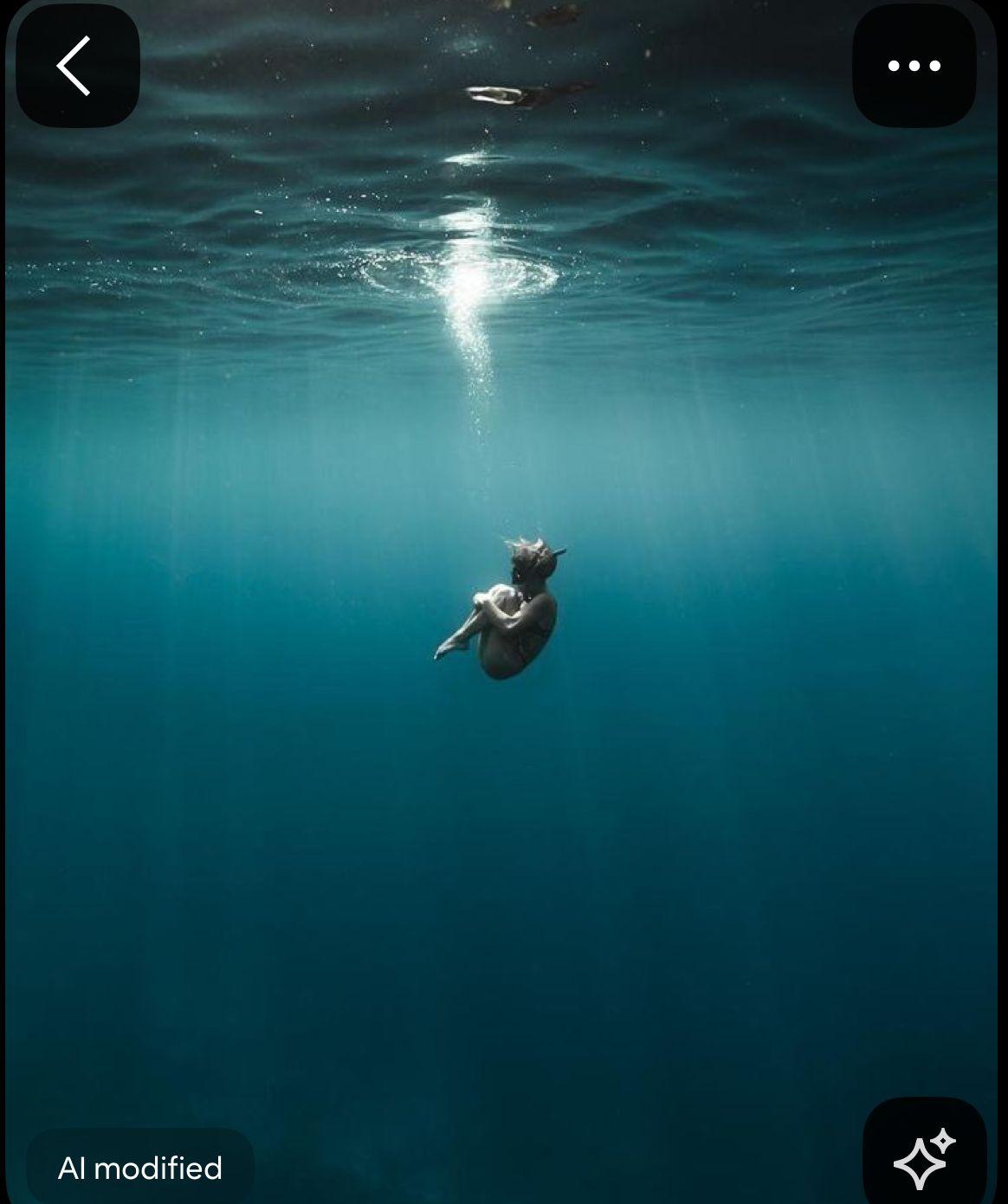 a photo of a person swimming in the ocean