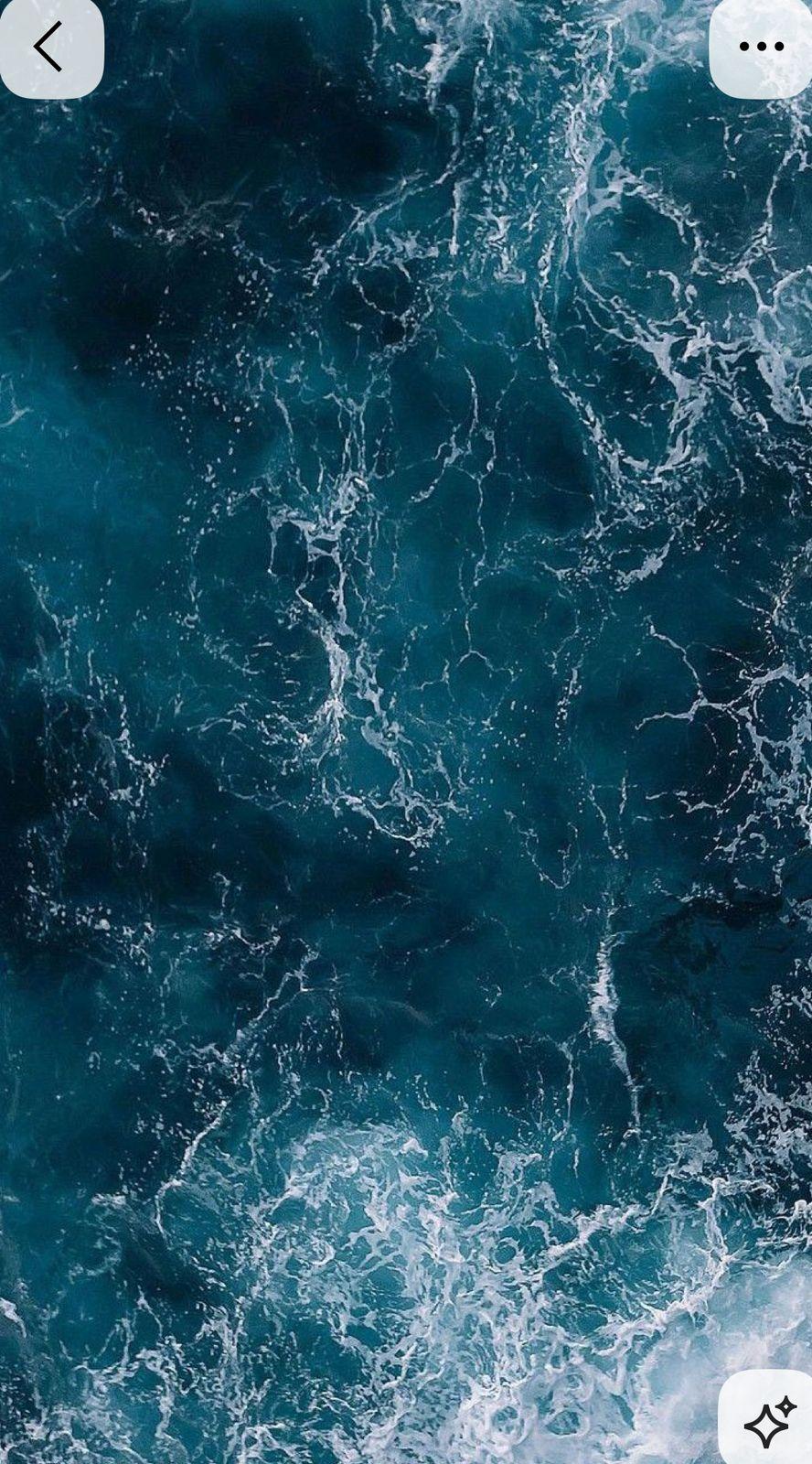 a cell phone with a picture of waves on the screen