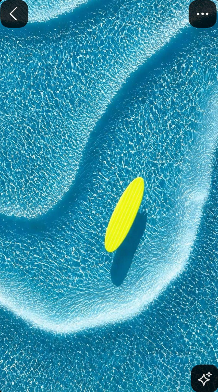 a yellow frisbee floating in a pool of water