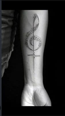 a person with a tattoo on their arm