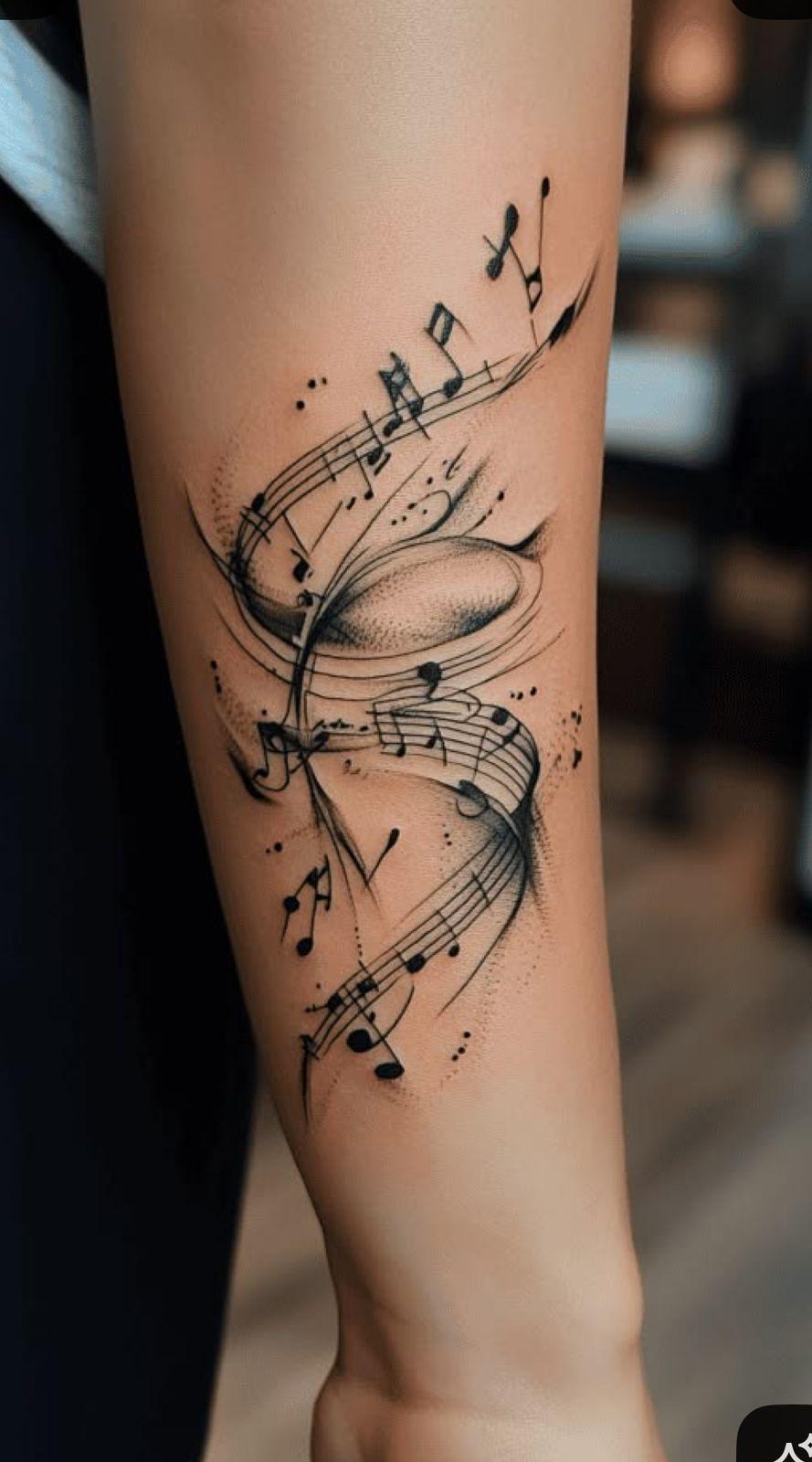 a woman's arm with musical notes on it