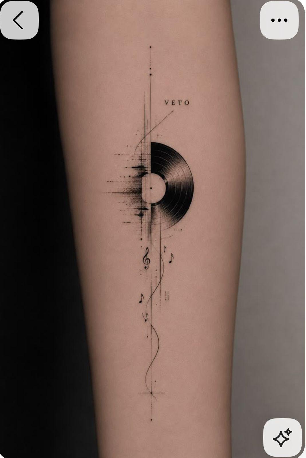 a black and white photo of a person's leg with a record on it