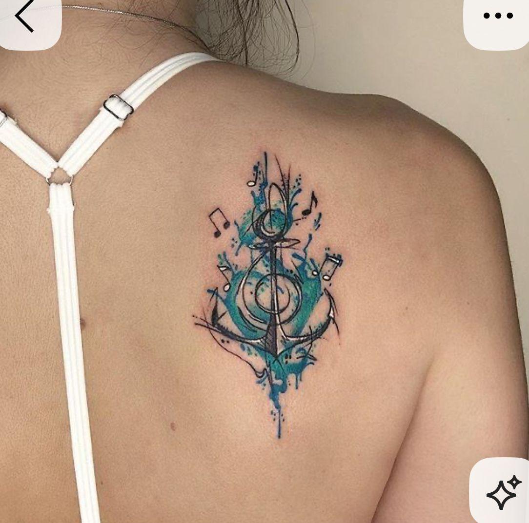 a woman with a tattoo on her back