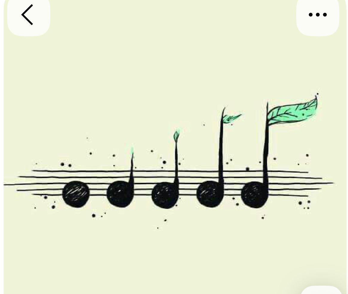 a musical note with a green leaf on it