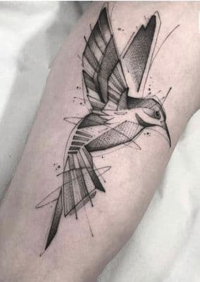 a black and white tattoo of a bird