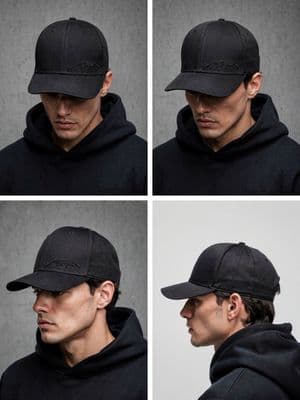 a man wearing a black hat and a black hoodie