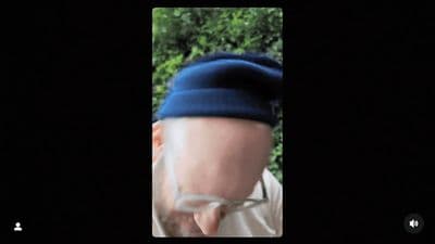 a man wearing a blue hat and glasses