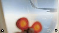 a view of the wing of an airplane through a window