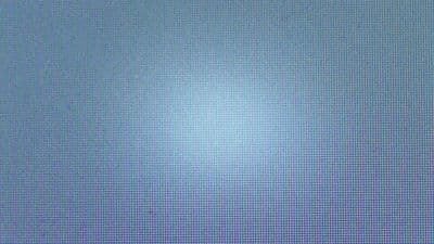 a blurry image of a blue sky with a white cloud