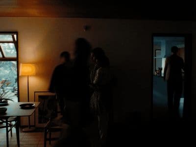 a group of people standing in a dark room