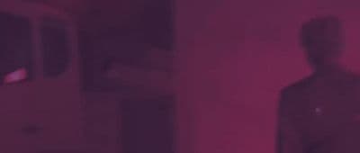 a blurry image of a person standing in a room