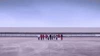 a group of people standing in front of a building