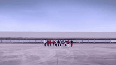 a group of people standing in front of a building