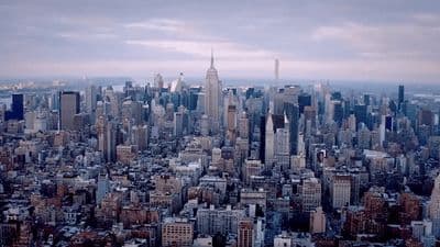 an aerial view of a city with tall buildings