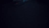 a blurry photo of a person skiing in the dark