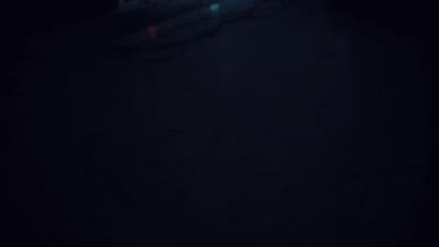 a blurry photo of a person skiing in the dark