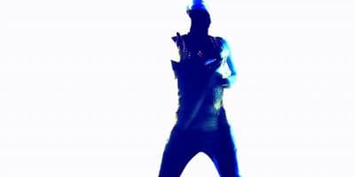 a silhouette of a man holding a cell phone