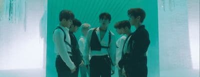 a group of young men standing next to each other