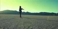 a person standing in the middle of a desert