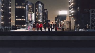 a group of people standing on top of a roof