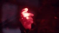 a close up of a red light in the dark