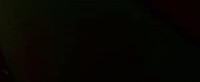 a blurry photo of a person holding a cell phone