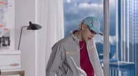 a person in a room with a view of the city