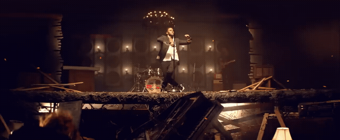 a man standing on a stage with a microphone