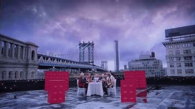 a group of people sitting at a table on a roof