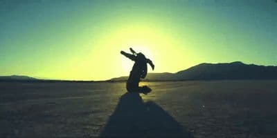 a person standing in the middle of a desert