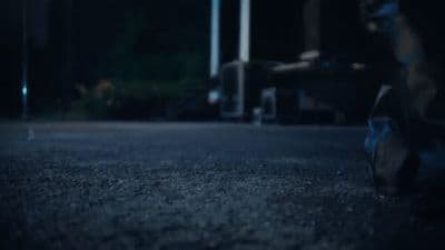 a blurry photo of a person sitting on the ground