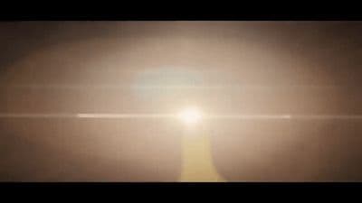 a blurry photo of the sun shining in the sky