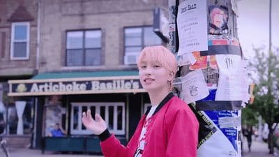 a woman standing next to a pole with a bunch of papers on it