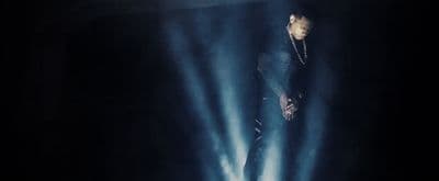 a man standing in the middle of a stage