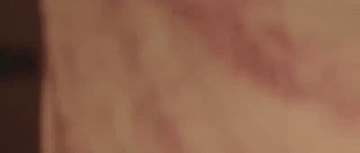 a blurry image of a person's hand holding a cell phone