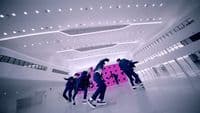 a group of young men riding skateboards in a building