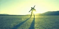a person standing in the middle of a desert