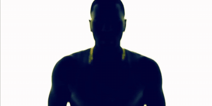 a silhouette of a man holding a tennis racquet