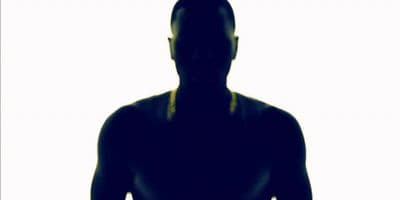 a silhouette of a man holding a tennis racquet