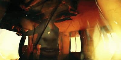 a blurry image of a man's face in a mirror