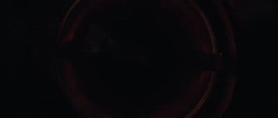 a dark picture of a toilet in a bathroom