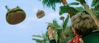 a woman flying a hamburger through the air