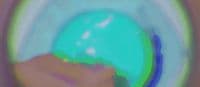 a blurry image of a person holding a green object
